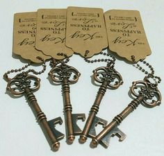 five antique keys with tags attached to them