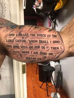 a man's arm with a bible verse tattooed on it and the words, and i heard the voice of the lord saying whom