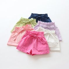 Available in Pink, Rose, White, Blue, Green, and Lavender Casual Pockets, Paperbag waist Woven fabric Anti-pilling, Breathable Nylon/Cotton Elastic waist Frill Blouse, Baby Girl Shorts, Shorts Cotton, Mixed Kids, Girls Shorts, Shorts Casual, Girls Wardrobe, Girl Clothing, Clothing Sets