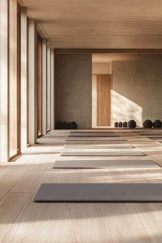 rows of yoga mats lined up in an empty room