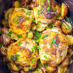 chicken and potatoes in a slow cooker with parsley sprinkled on top