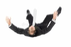 a man in a suit and tie is flying through the air with his arms outstretched