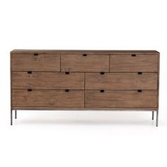 the chest of drawers is made out of wood and has metal legs on each side