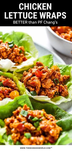 lettuce wraps filled with meat and vegetables on top of a white plate next to a