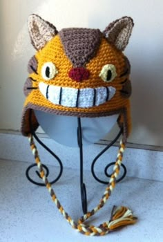 a crocheted hat with a cat's face on it