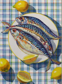 two fish sitting on top of a plate next to lemons