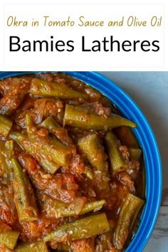 a blue bowl filled with okra in tomato sauce and olive oil