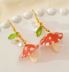 Cute mushroom fantasy forest vibe earrings to go with your everyday look 🧡 Cute Mushroom-shaped Earrings For Gifts, Cute Mushroom Design Dangle Earrings, Cute Dangle Earrings With Mushroom Design, Cute Mushroom Design Dangle Jewelry, Whimsical Dangle Earrings With Mushroom Design, Cute White Earrings With Mushroom Design, Cute White Mushroom Design Earrings, Whimsical White Mushroom Design Earrings, White Dangle Earrings With Mushroom Design