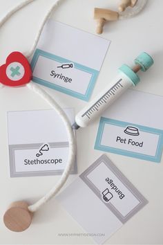 a white table topped with different items like a stethoscope and other items