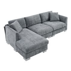 a large gray couch sitting on top of a white floor