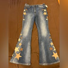 Bnwt Free People Driftwood Flare Star Jeans 32 Dark Wash Denim With Brown & Beige Star Detail Star On Jeans, Homecoming Jeans Ideas, Homecoming Jeans, Decorated Jeans, Western Pants, Jeans Ideas, Thrift Flips, Colorful Outfits, Painted Jeans