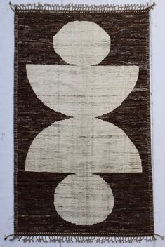 a brown and white rug with two circles on it