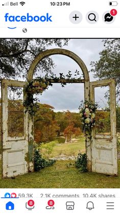 an old wooden door with flowers on it and the words facebook overlayed in red