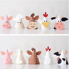 several paper hats with farm animals on them