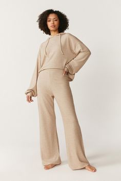 Living up to its name, these trousers are super soft to the touch. Perfect for lazy days, the cosy jersey comes with an elasticated drawstring waist and flowing wide-leg shape. Cosy Fashion, Cropped Henley, Henley Hoodie, Stacked Heel Ankle Boots, Chic Loungewear, Lounge Trousers, How To Make Coasters, Lazy Days, Loungewear Set