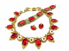 "Necklace, Bracelet & Beautiful Earrings. I am selling one of my long time favorite jewelry items ... Oval Cherry Red Faceted Glass Transparent and set in Brass Oval Setting with small pearl at base of setting, Round white Enamel Floral Design Set on a Brass Filigree Round Metal Discs with Seed Pearl Center. Each red faceted glass and faux pearl link measures 1 1/4\" x 11/16\" and each of the smaller domed links with a white enamel flower form with a central red glass cabochon is 5/8\" across. L Fine Jewelry With Jeweled Oval Details, Fine Jewelry With Oval Jeweled Details, Oval Jeweled Fine Jewelry, Elegant Red Jewelry With Cabochon, Elegant Red Cabochon Jewelry, Red Costume Jewelry Sets For Formal Occasions, Antique Jeweled Red Jewelry, Red Oval Victorian Jewelry, Victorian Style Red Oval Jewelry