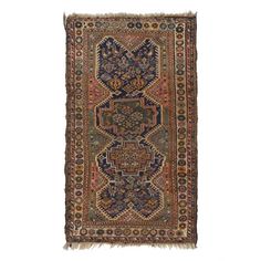 an antique persian rug with multicolored patterns and fringes on the bottom,