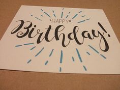 a birthday card with the words happy birthday written in cursive writing on it