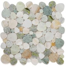 a white and green tile with pebbles on it