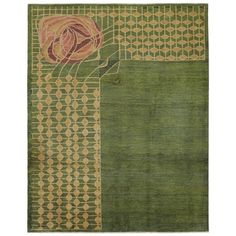 a green rug with an abstract design on the top and bottom, in different colors