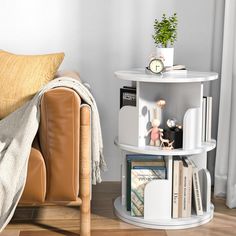 a living room with a couch, table and bookshelf