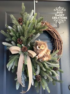 a wreath with an owl sitting on top of it