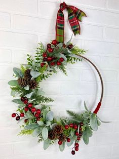 a christmas wreath hanging on a brick wall