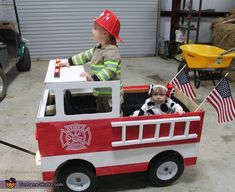 two children in a fire truck costume