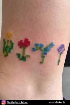 an image of some pixelated tattoos on the side of a woman's leg