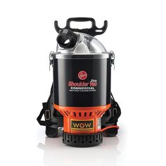 an orange and black portable camping stove with the lid down on it's side