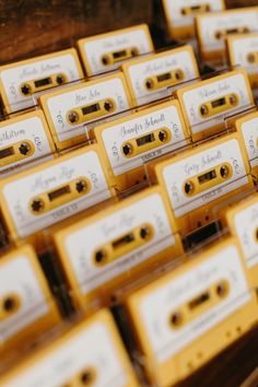 many cassette tapes are stacked on top of each other in order to be used as wedding favors