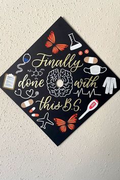 a graduation cap with the words finally done with this b5