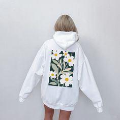 Add a touch of artistic charm to your wardrobe with this hoodie, featuring a vibrant graphic of daisy flowers inspired by Henri Matisse's iconic cutout style. A light washed/worn effect has been added to the design. Soft, durable and with an unique design, this hooded sweatshirt combines comfort with bold, expressive art for a one-of-a-kind look. Perfect for everyday wear or as a unique gift.  ✔️ Unique and eye-catching design ✔️ Soft and comfortable fabric for all-day coziness ✔️ Available in v Boho Hoodie, Flower Hoodie, Cutout Style, Flower Sweatshirt, Floral Hoodie, Gift Flower, Expressive Art, Sweatshirt White, Daisy Flowers