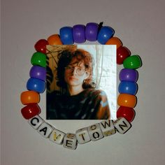 an image of a woman with glasses and name beads