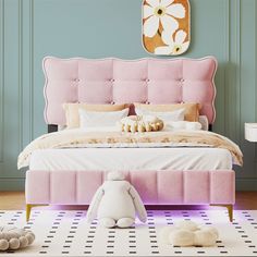 a pink bed sitting in a bedroom next to a white teddy bear on top of a rug