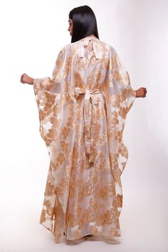 Turn heads in this mesmerizing floral Organza butterfly caftan dress, a true statement piece for the woman who loves to stand out. With its flowing butterfly sleeves and high neck design, this maxi-length beauty is perfect for black-tie events, luxurious resorts, or as an unforgettable wedding guest ensemble. Picture yourself twirling through a garden, or arriving at a fancy gathering with the vibrant floral gloss shimmering in the evening light. This dress is made for moments where elegance mee Luxury Festive Maxi Dress, Elegant Long Dress Kaftan For Formal Occasions, Evening Spring Maxi Length Kaftan, Elegant Maxi-length Kaftan, Elegant Cape Kaftan For Eid, Elegant Evening Kaftan For Spring, Elegant Spring Floor-length Kaftan, Elegant Spring Kaftan In Maxi Length, Elegant Floral Print Kaftan For Eid