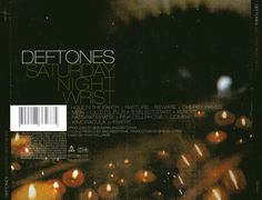 the cover art for deftones saturday night viber, which features candles and blurry lights