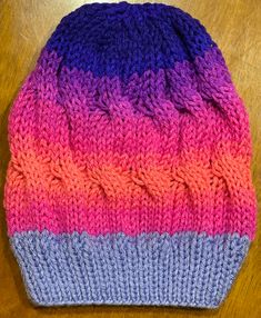 This lightweight beanie is knitted in loose Cable Knit  Slouchy Beanie style, that will help keep you warm during the chilly seasons. The fun bright sunset colors with a lavender purple brim will add a fun pop to any outfit in your wardrobe.  This beanie is knitted with love and the hope that you or whomever you gift it to will love it for years to come.  Easy care, wash on gentle and dry on low heat or allow to air dry. Part of the proceeds from this sale will go towards helping those in need in the Pacific Northwest Communities.  Thank you for your support in advance! Casual One-size Purple Crochet Hat, Purple One Size Beanie Hat, Casual Purple Crochet Hat, Purple Beanie Hat, One Size, Multicolor Knit Beanie One Size Fits Most, Hand Knitted Purple Yarn Hats, Brimmed Knitted Beanie, One Size Fits Most, Purple Hand Knitted Crochet Hat, Warm Purple Hats For Cold Weather