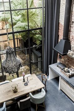 an image of a living room with wooden doors and furniture in it's center