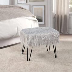 the foot stool is made from metal and sheepskin