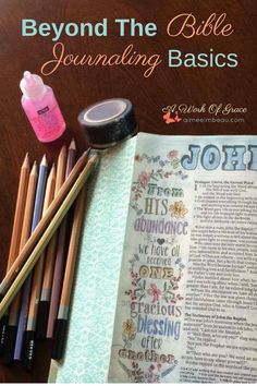 an open bible next to colored pencils and other items on a table with the title beyond the bible journaling basics