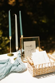 the table is set with candles, napkins and other items for guests to use