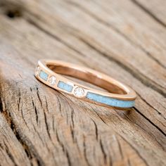 a close up of a ring on a wooden surface