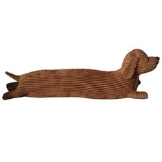 a wooden dachshund laying on its side