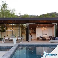 a pool house with an outdoor living area