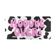 a skateboard with the words moove over in pink and black on it