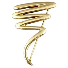 PALOMA PICASSO FOR TIFFANY & CO ZIG-ZAG SQUIGGLE PIN Description / Condition: Mint. All jewelry has been professionally scrutinize and cleaned prior to being offered for sale. Gender: Woman Manufacturer: Tiffany & Co. Model: Paloma Picasso Zig-Zag Brooch Measures: 47 mm Long by 31 mm wide Weight: 13.7 grams One of the more substantial versions of this iconic design by Paloma Picasso for Tiffany & Co, this version comes in at a hefty 13.7 grams in total weight and is incredibly eye catching with Paloma Picasso, American Modern, Tiffany And Co, Iconic Design, Pin Brooch, Paloma, Tiffany & Co., Zig Zag, Brooch Pin