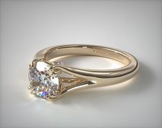 a close up view of a ring with a diamond on it's shants