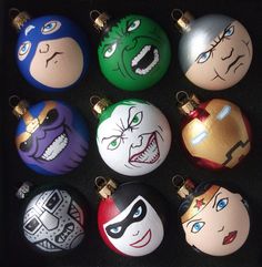 six different colored ornaments with faces painted on them