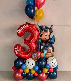 a balloon sculpture with the number three on it